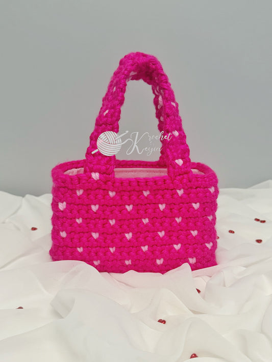 Hot pink crochet tote with light pink hearts.