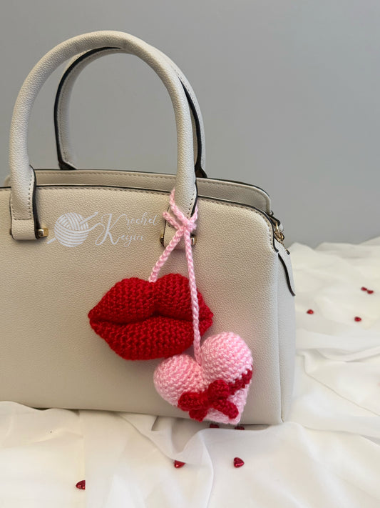 Pink heart plush with a red bow and red lips plush